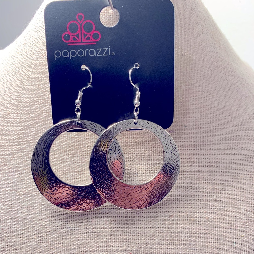 Silver flat hoop earrings with fishhook backing.